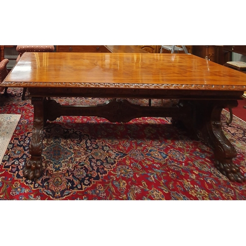 A Superb 19th Century Walnut Writing Table with cross banded and moulded top on highly carved supports with hairy paw feet and triple drawer frieze. W201 x D102 x H77cm approx.