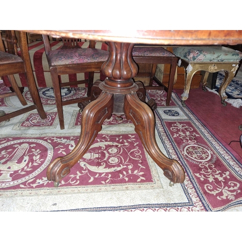 339 - A large 19th Century Mahogany oval supper Table with molded edge on quatrefoil base.
H 72 x D 107 W ... 