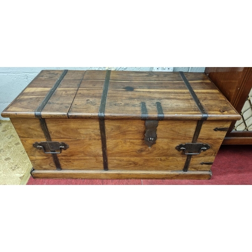 71 - A hardwood Metal bound Trunk/ Coffee Table.