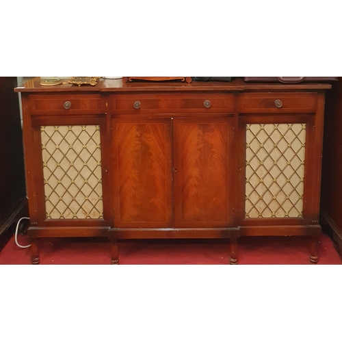 76 - A good Mahogany and Veneered breakfront low Cabinet having three frieze drawers a central cupboard f... 