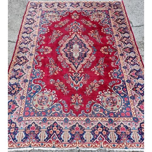 83 - A fantastic rich Red/ Burgundy ground Iranian Carpet with a bespoke floral medallion design from the... 