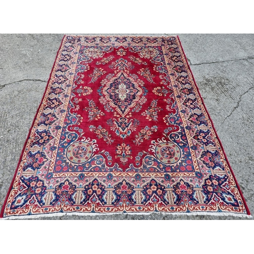 83 - A fantastic rich Red/ Burgundy ground Iranian Carpet with a bespoke floral medallion design from the... 