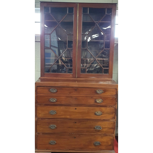 86 - An early 19th Century Mahogany Secretaire Bookcase with a highly carved architectural pierced pedime... 