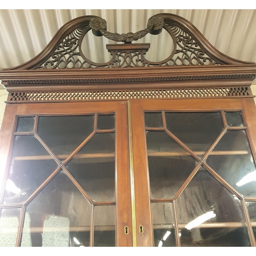 86 - An early 19th Century Mahogany Secretaire Bookcase with a highly carved architectural pierced pedime... 