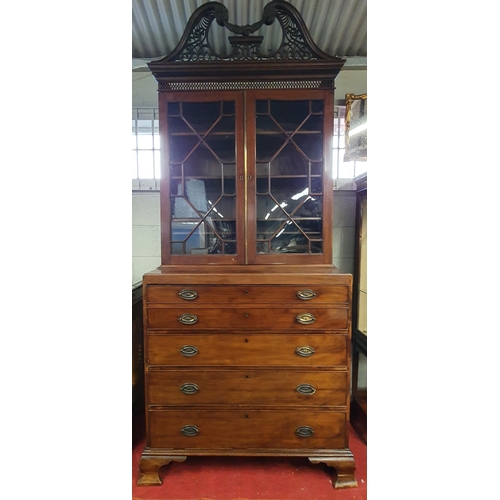 86 - An early 19th Century Mahogany Secretaire Bookcase with a highly carved architectural pierced pedime... 