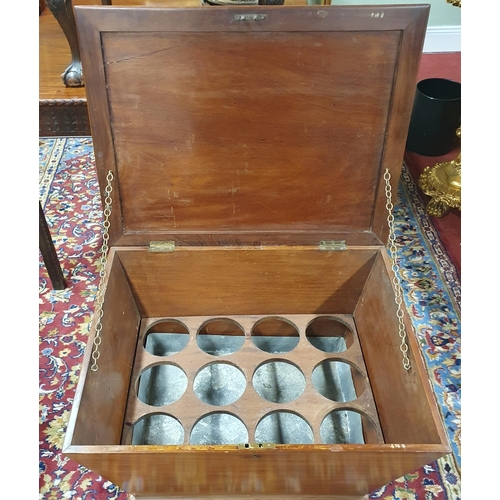 293 - A Mahogany Cellarette of sarcophagus form on bun feet, the interior with lead lined compartment for ... 