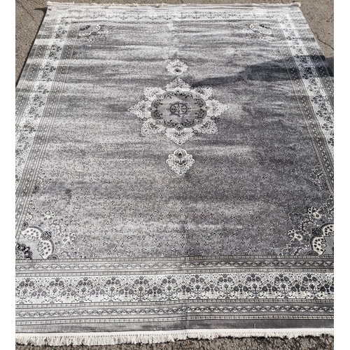 333 - A large full pile Turkish Carpet with an all over Gray ground and a central medallion design. 500 x ... 