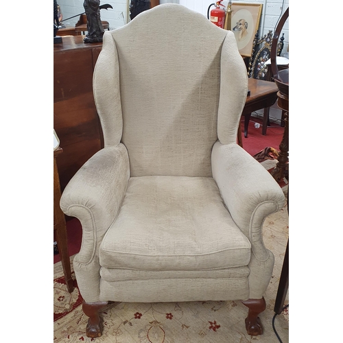 56 - A good Mahogany showframe wingback Armchair with beige upholstery and ball and claw supports. 89 x 8... 