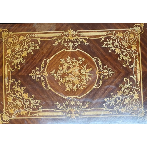 89 - A Rosewood and Inlaid fold over Card Table with turned supports and ormolu mounts and highly inlaid ... 