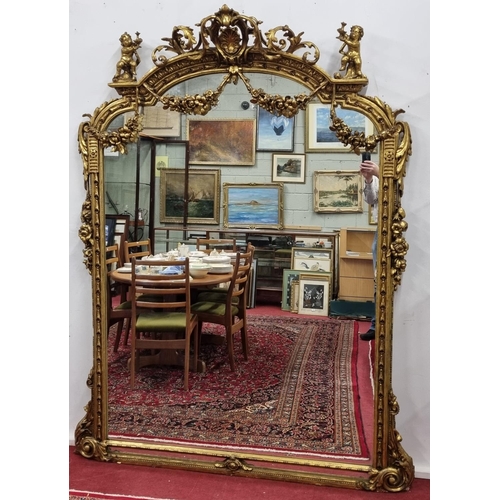261 - A fabulous Timber and plaster Gilt overmantel Mirror with a highly molded outline, highly molded ped... 