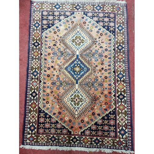 273 - A good Persian Yalameh Rug with unique medallion design. 150 x 104 cm approx.