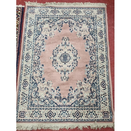 275 - A Pink ground Rug.