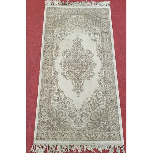 301 - Eastern style cream ground wool pile rug with central floral medallion, multiple floral borders 178c... 