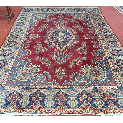 83 - A fantastic rich Red/ Burgundy ground Iranian Carpet with a bespoke floral medallion design from the... 