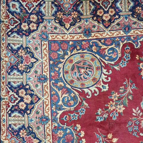 83 - A fantastic rich Red/ Burgundy ground Iranian Carpet with a bespoke floral medallion design from the... 