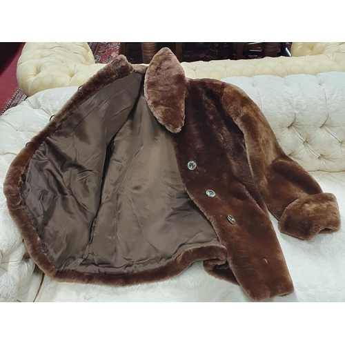 382 - A Faux Fur Coat , light brown silk Lined .