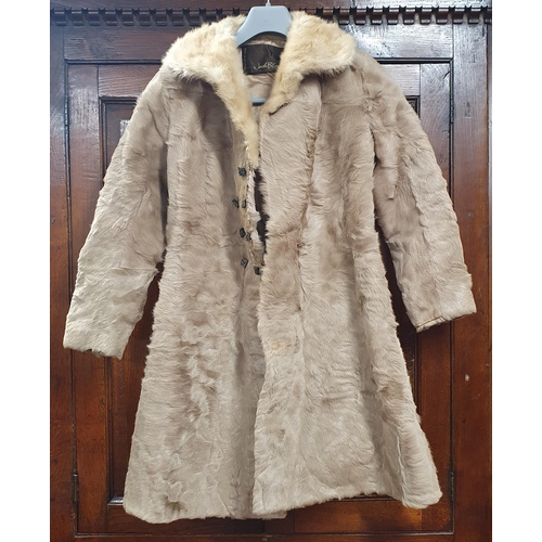 383 - A Good Fur Coat, light brown silk lined by Jack Bloom of Dublin. Small size.