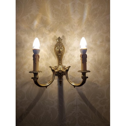 61 - A 2 Branch Brass wall light. Height 35 cm approx. (Please note this is a Generic Photograph , There ... 