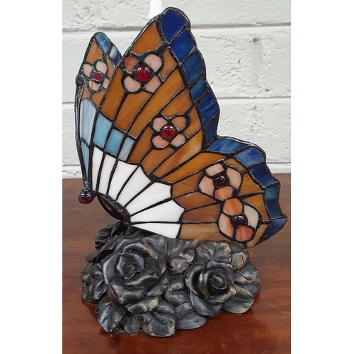 31 - A stained Glass Lamp in the form of a butterfly. H 24 cm approx.