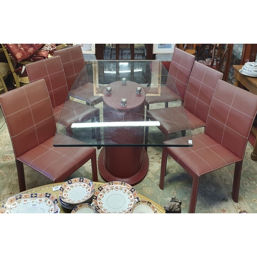 68 - A really good modern Dining Table  with glass top and centre base, faux leather chairs. In very good... 