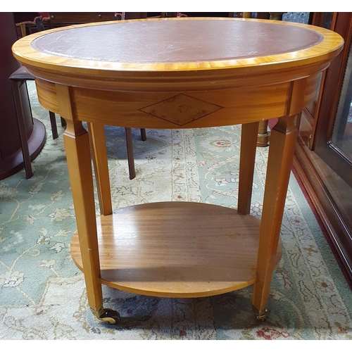 69 - A good Satinwood oval two tiered Table with leather top on square supports. W 65 x 45 x H 70 cm appr... 