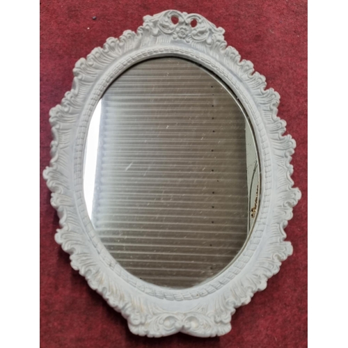 859 - An early 20th Century highly moulded Mirror.