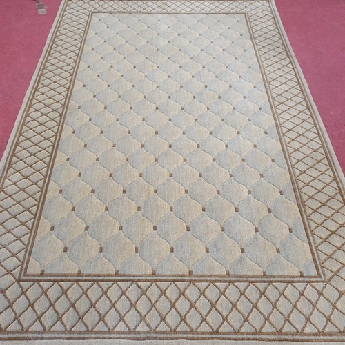 409 - A Tan and Light Blue Carpet.
L 250 x W 160 cm approx.