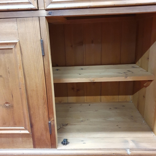 105 - A Pine Kitchen Dresser of neat proportions. H 190 x W 182 x D 50 cm approx.