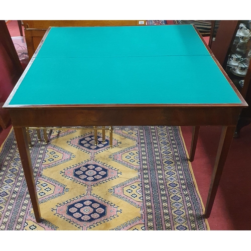 113 - A Regency Mahogany Foldover Card Table with inlaid corners and square tapered supports. H 73 x W 90 ... 