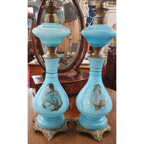 133 - A Pair of 19th Century opaline blue glass Oil Lamps decorated with the portraits of Napoleon and Jos... 