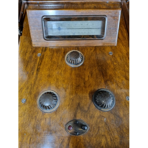 305 - A good early 20th Century Gramophone with a Walnut case. H 96 x W 84 x D 50 cm approx.