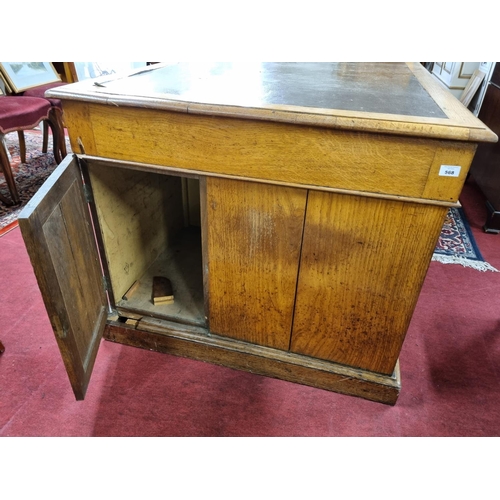 406 - A 19th Century Oak Pedestal Desk of good rectangular form with brown leather top and brass drop hand... 