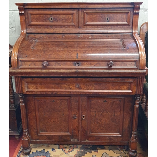 132 - A 19th Century Continental Walnut cylinder Bureau, the top with two drawers, a roll top to reveal a ... 