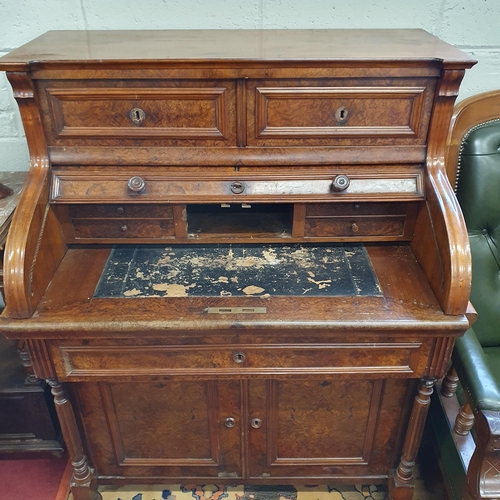 132 - A 19th Century Continental Walnut cylinder Bureau, the top with two drawers, a roll top to reveal a ... 