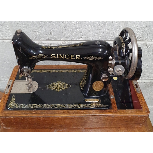 200 - A cased Singer Sewing Machine.