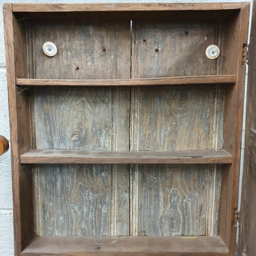 206 - An 18th Century Oak narrow panelled wall mounted Cabinet. W 61 x D 11 x H 68 cm approx.