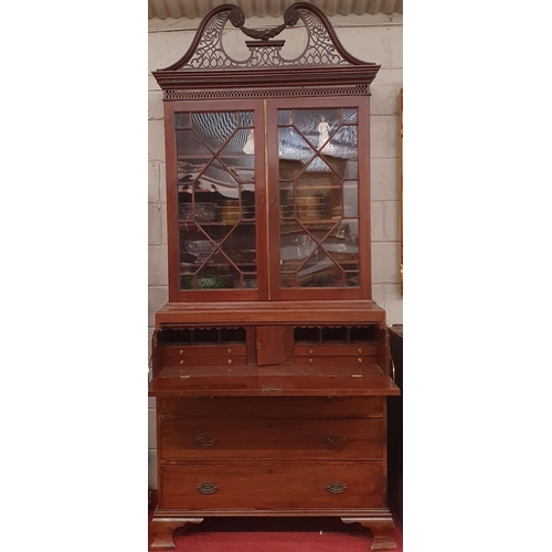 244 - An early 19th Century Mahogany Secretaire Bookcase with a highly carved architectural pierced pedime... 