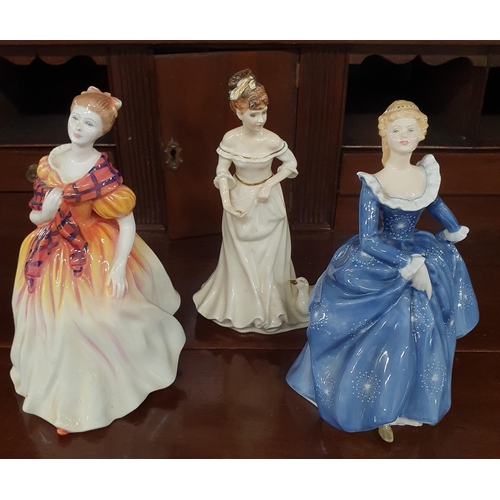 245 - A group of three Royal Doulton Figures. H 20 cm approx.