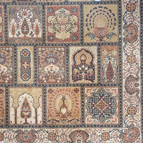 274 - A brown and cream ground Rug with repeating central decoration. 205 x 143 cm approx.