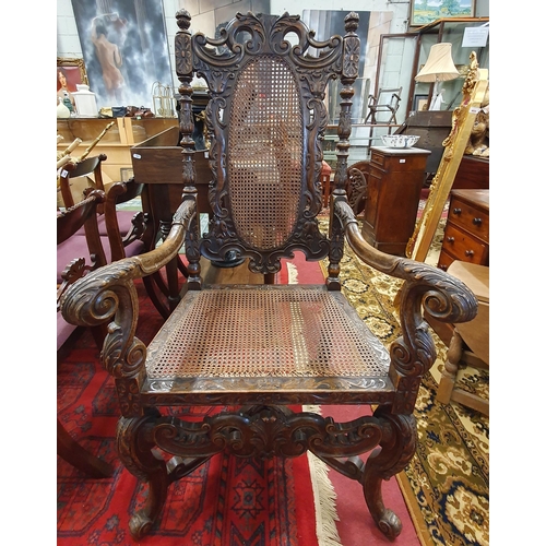 299 - A 19th Century Oak provincial Carver with highly carved outline and carved cabriole front supports w... 