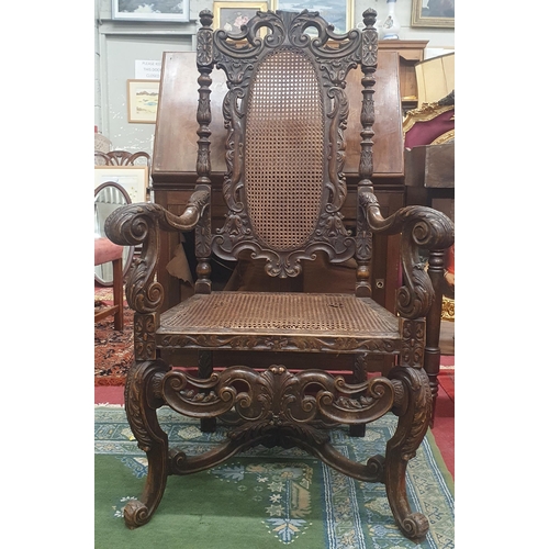 299 - A 19th Century Oak provincial Carver with highly carved outline and carved cabriole front supports w... 