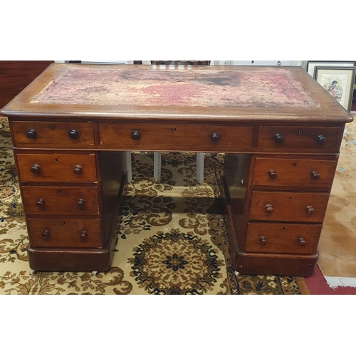 306 - A 19th Century Mahogany Pedestal Desk of neat size with triple drawer frieze on top of a bank of thr... 