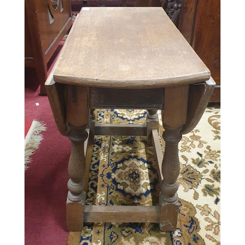 310 - An early 20th Century Oak swivel miniature Dropleaf Table. 55 x 72 x H 48 cm approx.