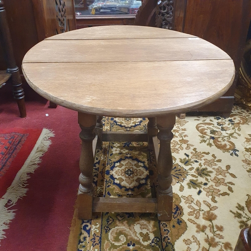 310 - An early 20th Century Oak swivel miniature Dropleaf Table. 55 x 72 x H 48 cm approx.