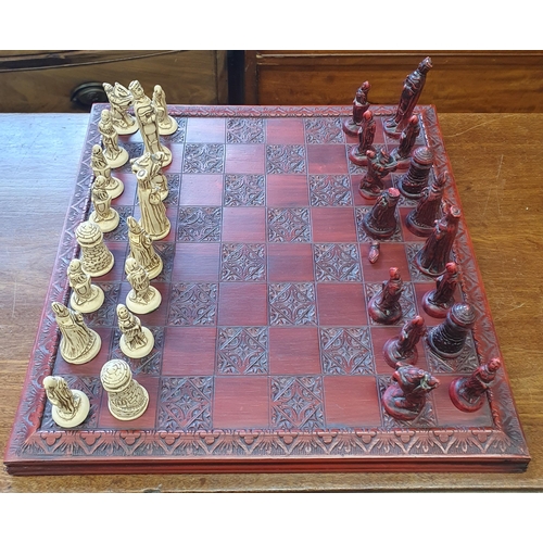 380 - A good Chess Set along with a Players card collage.