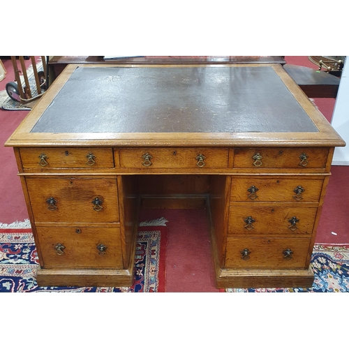 406 - A 19th Century Oak Pedestal Desk of good rectangular form with brown leather top and brass drop hand... 