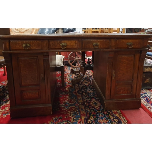 409 - A modern Oak Pedestal Desk with triple panel leather top. 131 x 55 x H 75 cm approx.