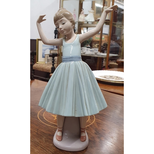 45 - A Lladro Figure of a young child as a Ballerina. H 27  cm approx.