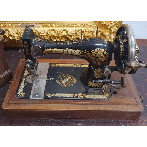 466 - A cased Sewing Machine.