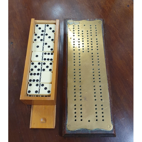 492 - A quantity of Dominoes along with a 19th Century game counter. (object counter)